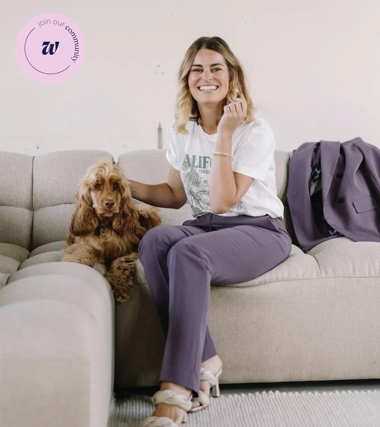 An image of a woman sitting on the couch with a dog