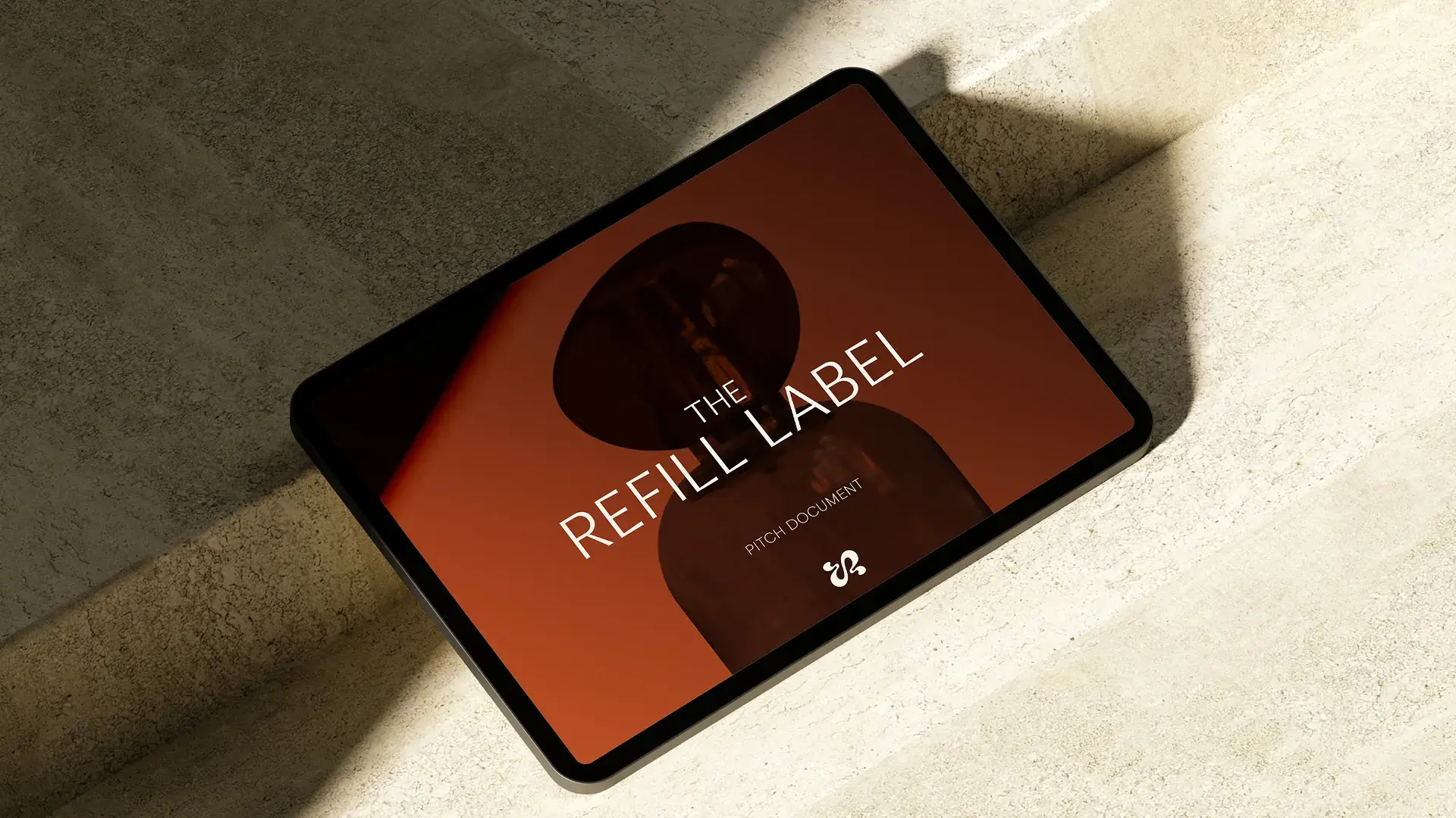 Light background with red logo on screen