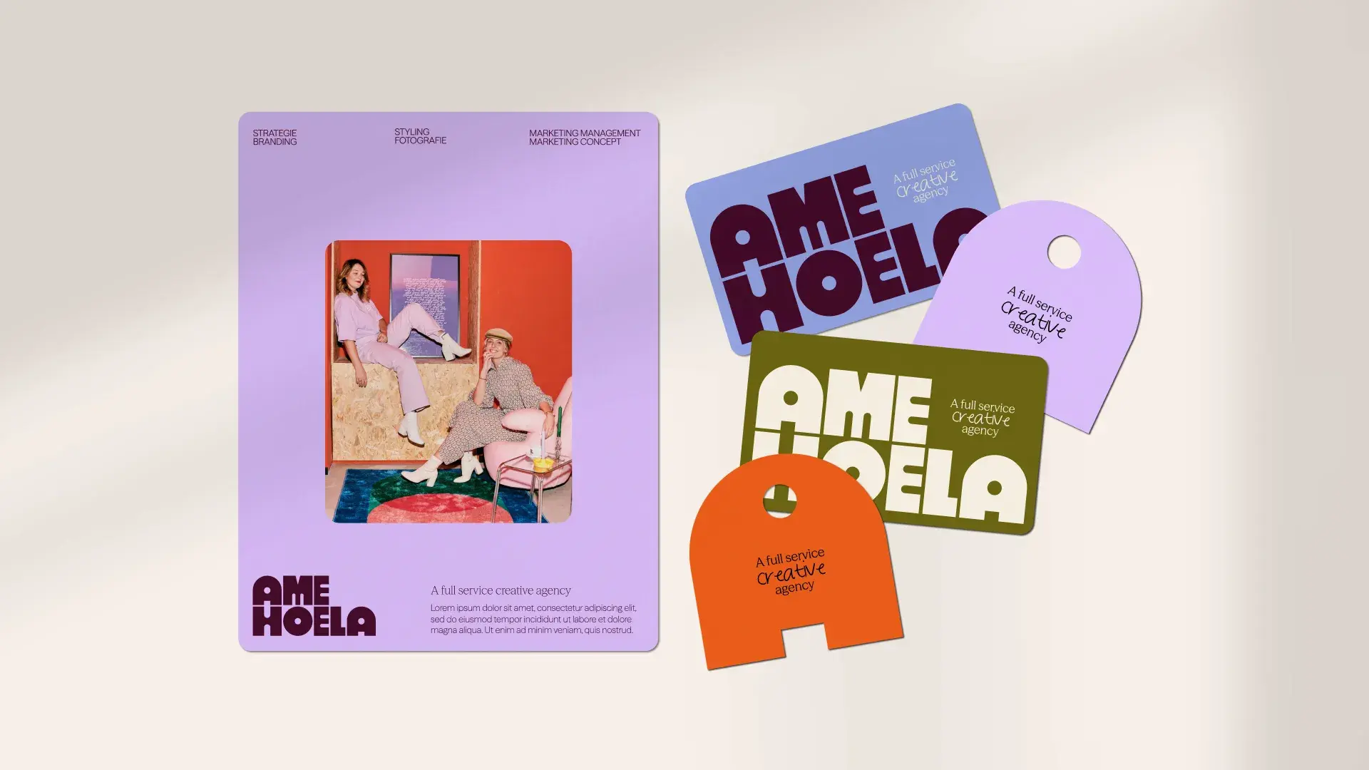 A colorful marketing agency brochure and cards featuring bold text and graphics with a creative, modern design aesthetic on a light background.