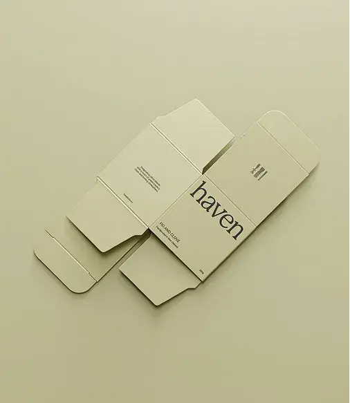 Cream-colored flat packaging on a matching background has the text "haven" and design details visible, showcasing elegant branding.